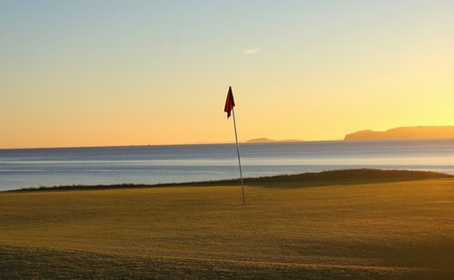 12th green, winter sunset at Shiskine Golf Course